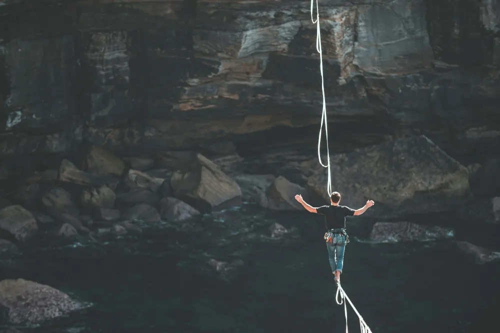 A man walking on a steel wire that is impacted by the CBAM regulation, so Dubrink can help.